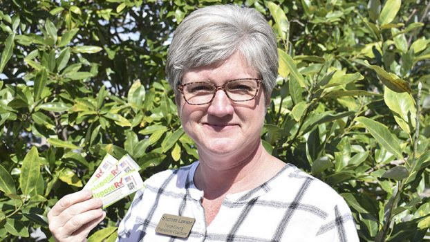 Parent Engagement: Troup County Prevention Coalition project coordinator Shannon Lawson poses for a photo with DisposeRX packets. Credit Gabrielle Jansen | LaGrange Daily News