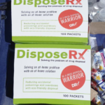 DEA National Prescription Drug Take Back Day table featuring education materials and DisposeRx at-home medication disposal packets.