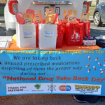 DisposeRx at-home medication disposal packet boxes on giveaway table