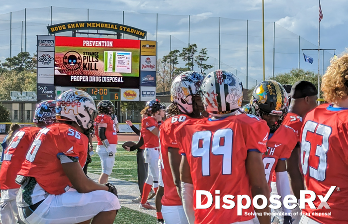 Football team and Coaches vs Overdoses on the scoreboard